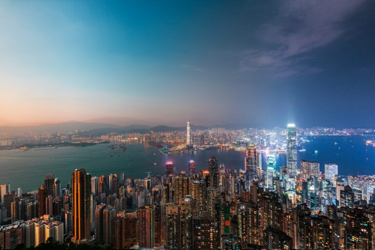 Hong Kong skyline and Victoria Harbour seen from The Peak at dusk, backdrop to the New Capital Investment Entrant Scheme